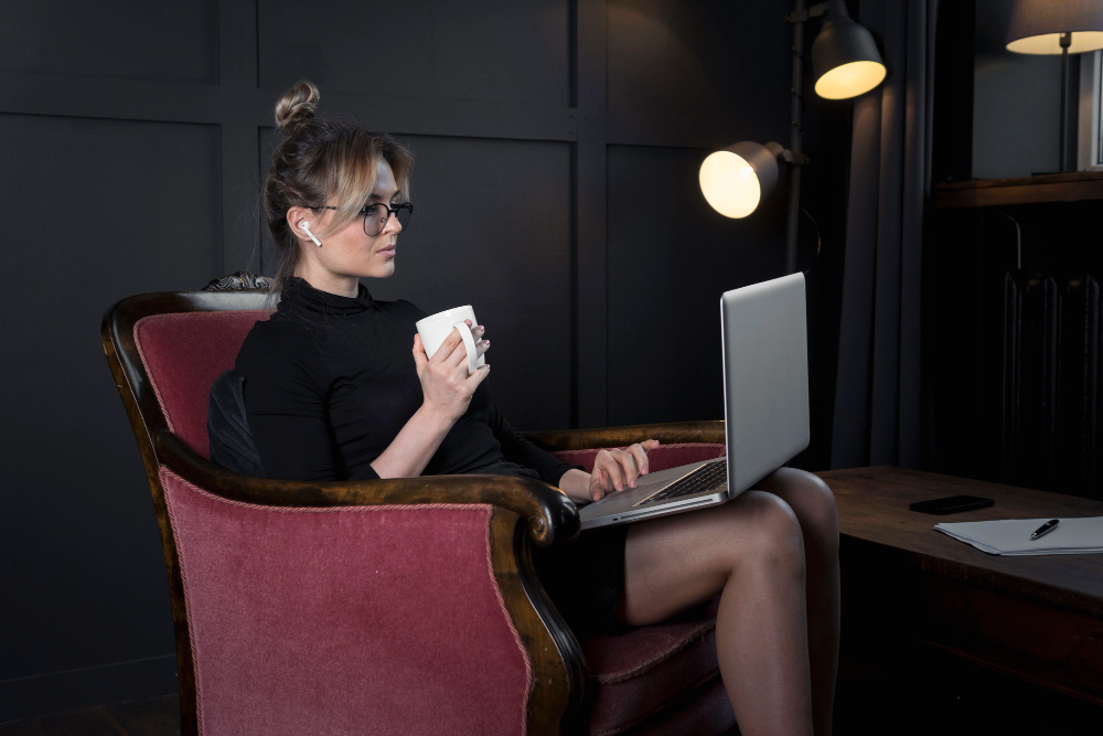 A blogger creating a Pinterest strategy with a laptop and visual content ideas.