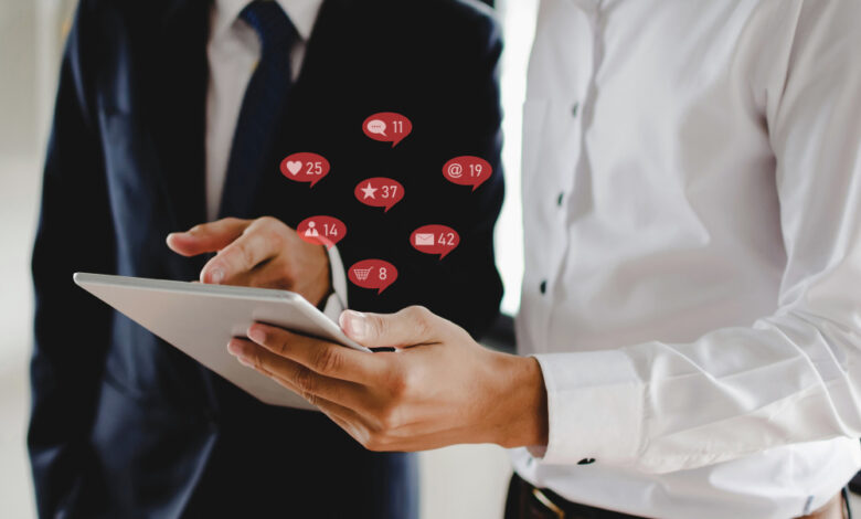 Small business owner choosing digital marketing services with a laptop