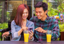 A smartphone displaying a Snapchat location-based story ad with a vibrant background.