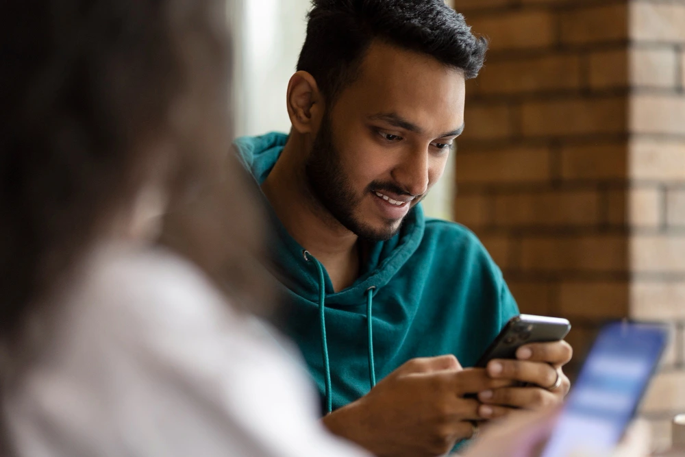 Snapchat interface showing the Friend Check-Up reminder feature to review contacts.